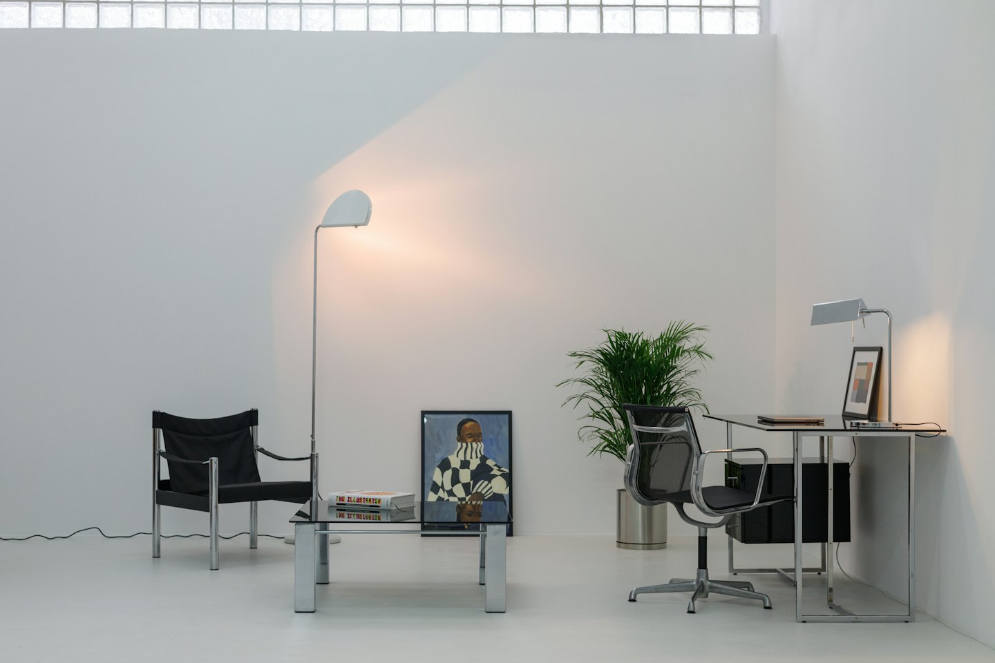 Nowoczesne biuro i salon z minimalistycznymi meblami.
